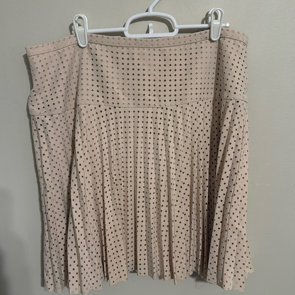 Laser cut pleated skirt